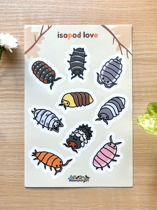 A sticker sheet with various colorful isopod designs, displayed on a wooden surface with a 'isopod love' text at the top.